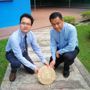 Alex Song and Rev Johnny with the first marker in Brunei