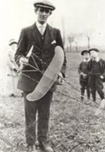 Young Sydney Camm holding one of his model aeroplanes